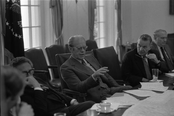 President Gerald Ford, Secretary of State Henry Kissinger, Deputy Secretary of Defense William Clements, Ambassador L. Dean Brown, Secretary John Marsh, and White House Chief of Staff Richard Cheney attend a meeting of the National Security Council in the White House Cabinet Room, 6/17/976.