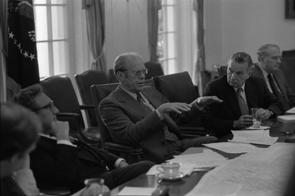 President Gerald Ford, Secretary of State Henry Kissinger, Deputy Secretary of Defense William Clements, Ambassador L. Dean Brown, Secretary John Marsh, and White House Chief of Staff Richard Cheney attend a meeting of the National Security Council in the White House Cabinet Room, 6/17/976.