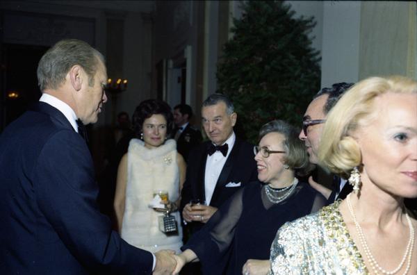 President Ford, Betty Ford, Martin Hoffman, Thomas Reed, George S. Brown, David Jones, Bernard Rogers, Louis Wilson, John Hennesey, Daniel James, Jr., Russell Daugherty, Robert Huyser, Anthone McAuliffe, James Holloway, Eugene Siler, Isaac Kidd, Maurice Weisner, William Hyland, and their spouses prior to a dinner for the Secretary of Defense, Service Secretaries, Joint Chiefs of Staff, and Commanders or the Unified Commands in the White House Grand Hall, 12/11/1976.