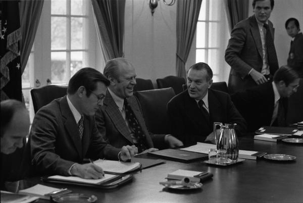 Gerald Ford, Donald Rumsfeld, William Clements, General John Wickham, Terence McClary, Leonard Sullivan, Richard Cheney, Brent Scowcroft, James Lynn, Paul O'Neill, Donald Ogilvie, Dale McOmber, and General George S. Brown attend a meeting with the Joint Chiefs of Staff and the Secretary of Defense to discuss the 1977 United States budget, 12/13/1975.